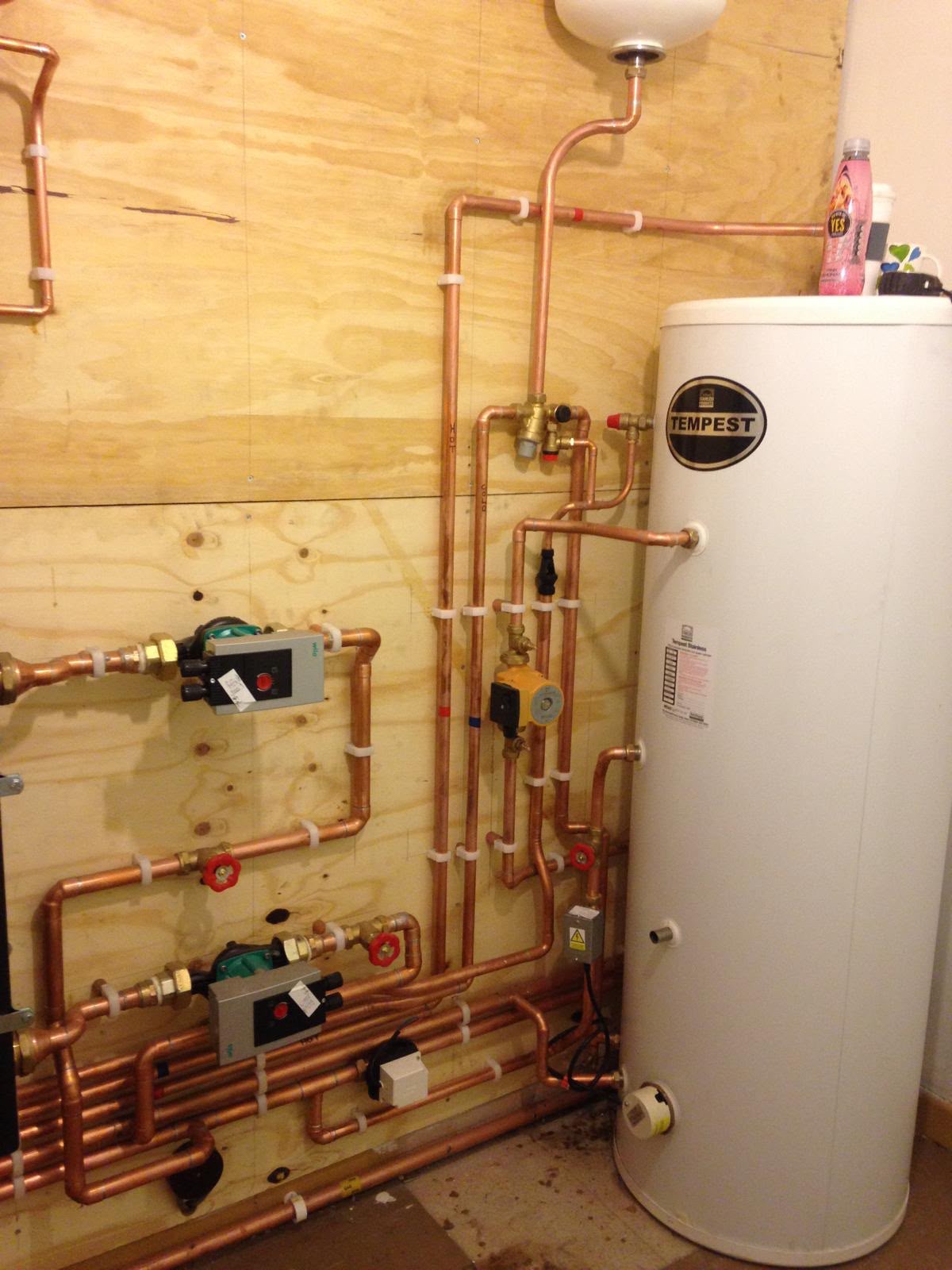 Unvented hot water cylinder system with neat copper pipework installed by PLA Plumbing & Heating